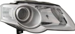 Strålkastare Vänster VW Passat 3C